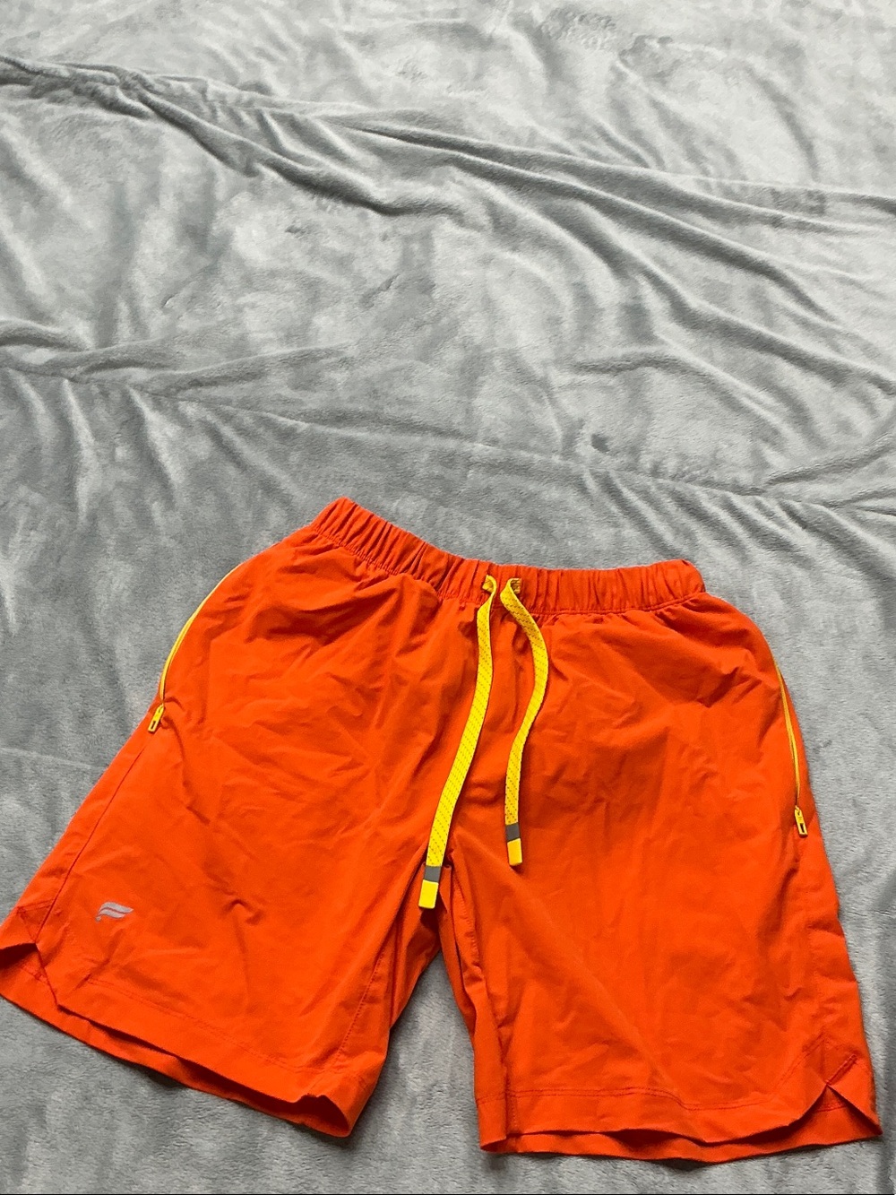 Fabletics Men's Athletic Shorts in Orange with Yellow Drawstring